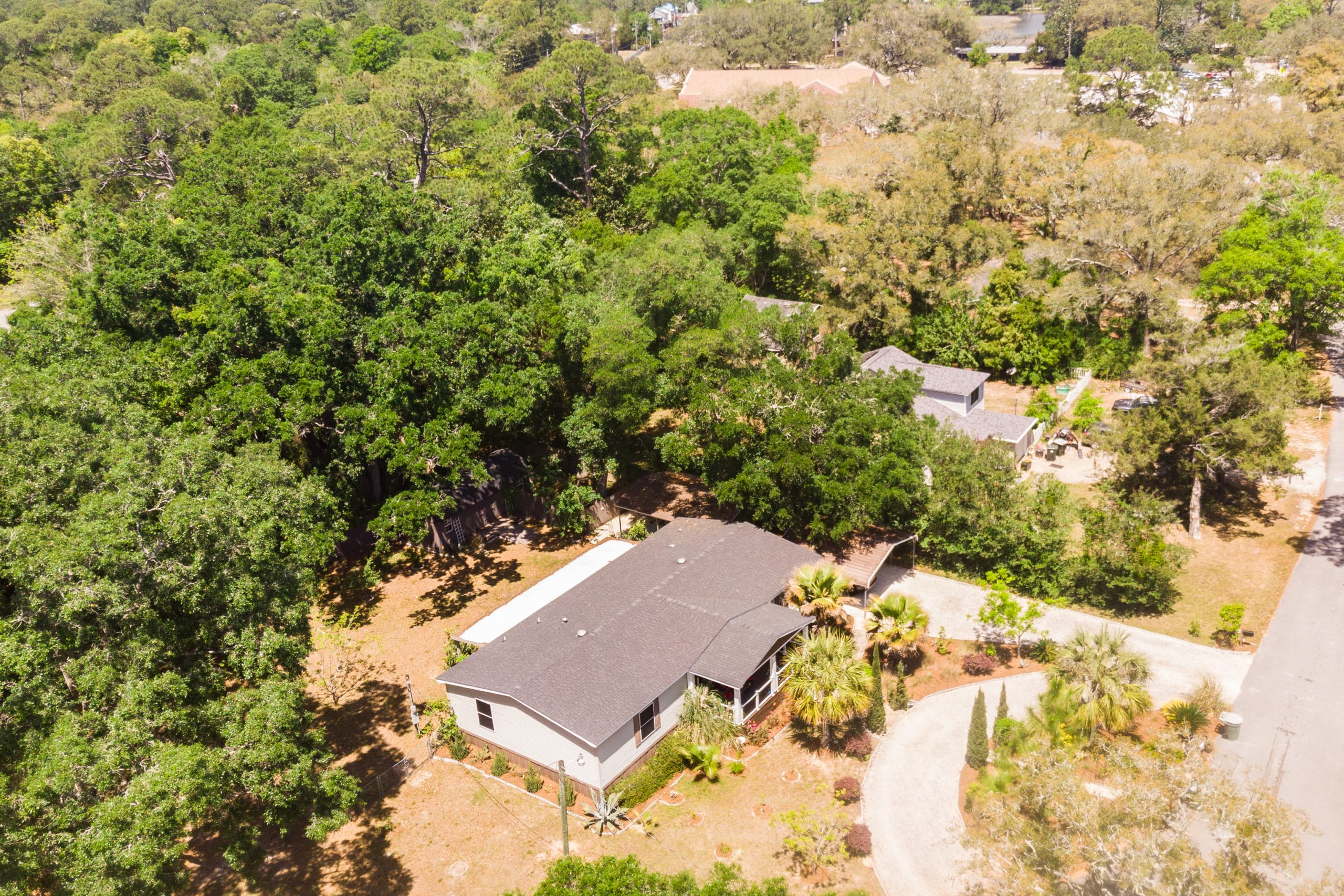 Aerial view of a home in Pensacola, Florida with updated pricing